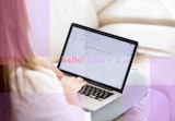 A user beginning to write an email as her email provider autocompletes her sentence.