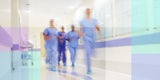 Doctors rush down a hospital hallway.